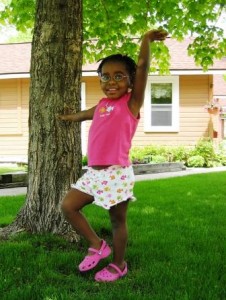 Birhane posing at the tree