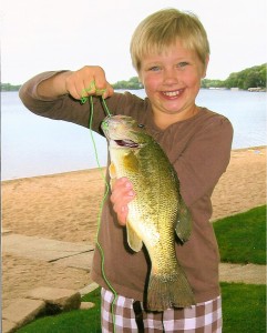 Emma holding a Large Mouth Bass