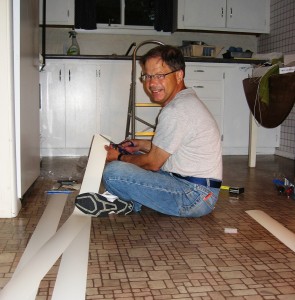 Bob putting up vertical blinds in cabin #5