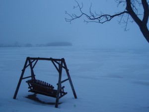foggy lake with adirondack swing